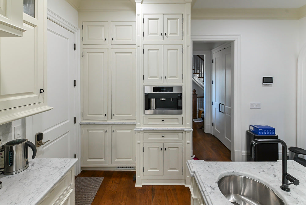 Traditional Creamy White Kitchen with Island, Marble Countertops and Appliances