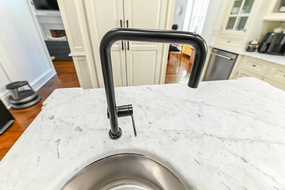 Traditional Creamy White Kitchen with Island, Marble Countertops and Appliances