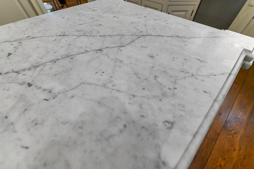 Traditional Creamy White Kitchen with Island, Marble Countertops and Appliances