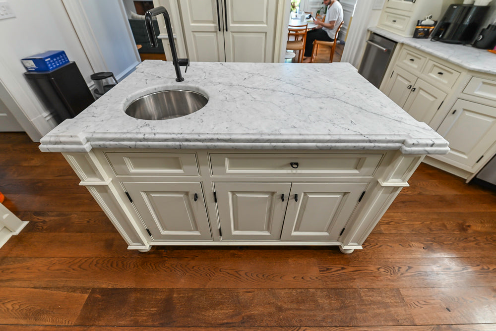 Traditional Creamy White Kitchen with Island, Marble Countertops and Appliances