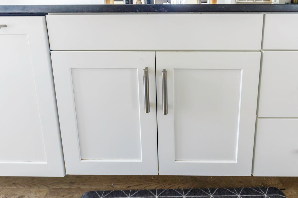 Transitional White Kitchen with Marble Waterfall Island and Thermador Appliances