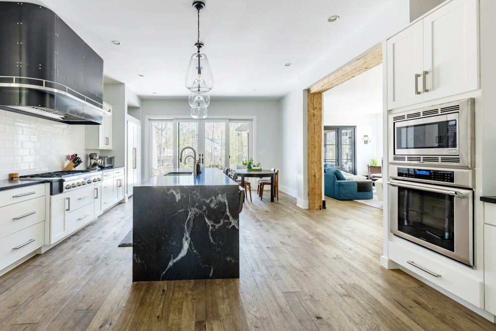 Transitional White Kitchen with Marble Waterfall Island and Thermador Appliances