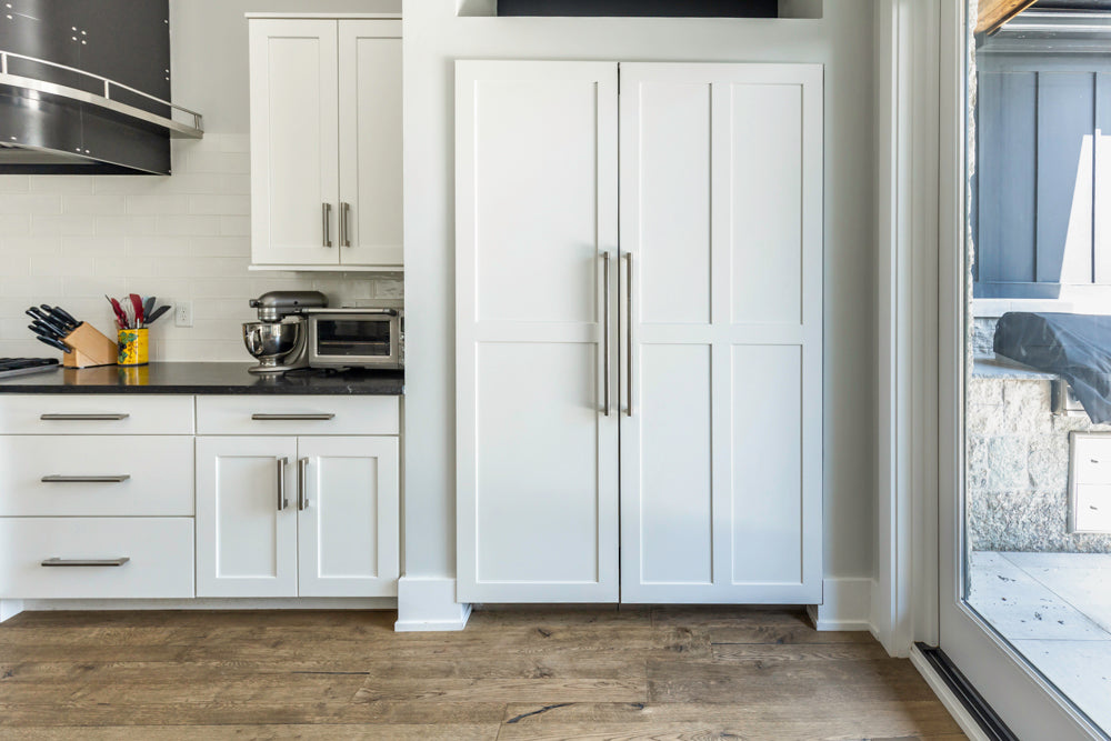 Transitional White Kitchen with Marble Waterfall Island and Thermador Appliances