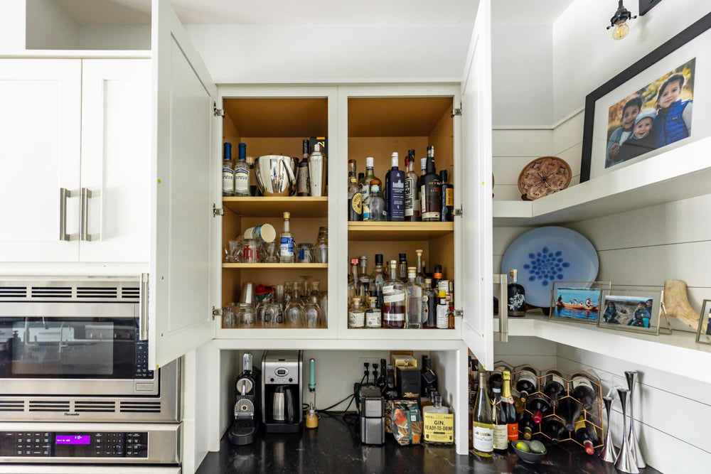 Transitional White Kitchen with Marble Waterfall Island and Thermador Appliances