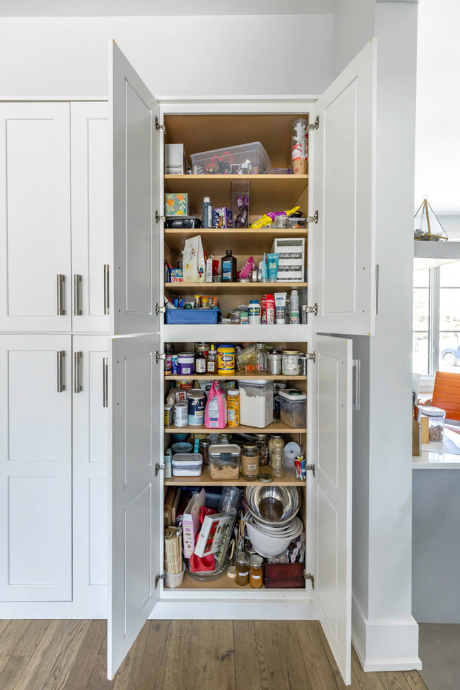 Transitional White Kitchen with Marble Waterfall Island and Thermador Appliances