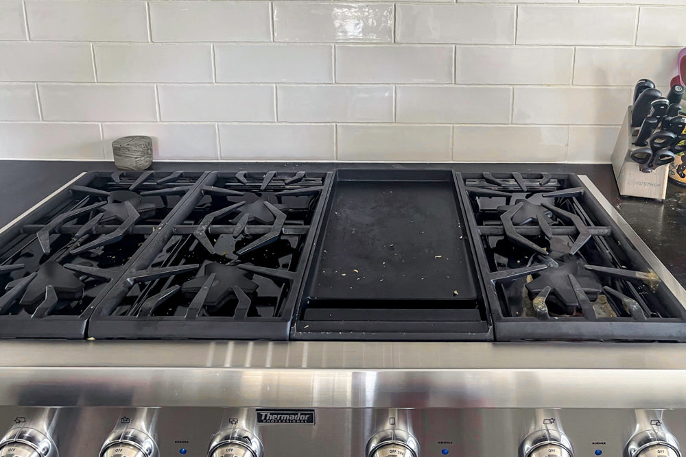 Transitional White Kitchen with Marble Waterfall Island and Thermador Appliances