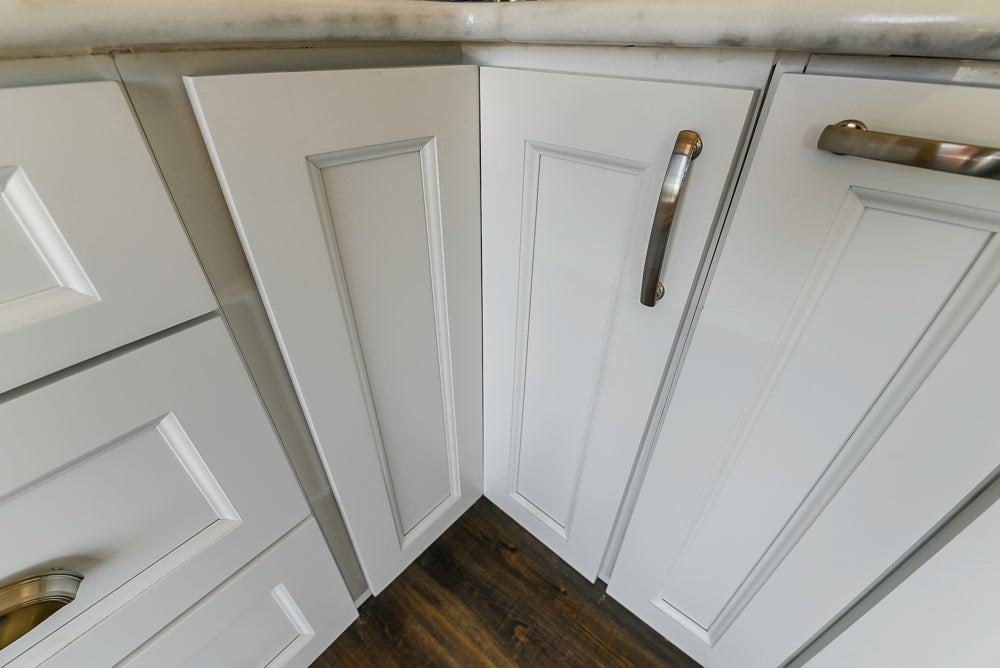 Forevermark Traditional White Kitchen Corner with White Marble Countertops