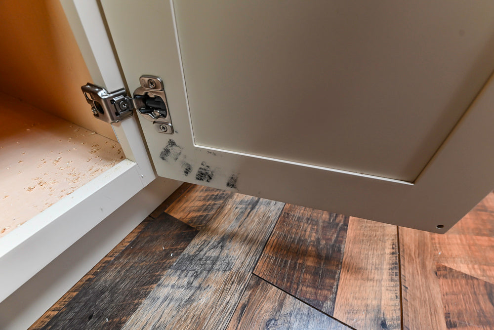 Light Cream Kitchen Corner with Quartz Countertops and Marble Top Island