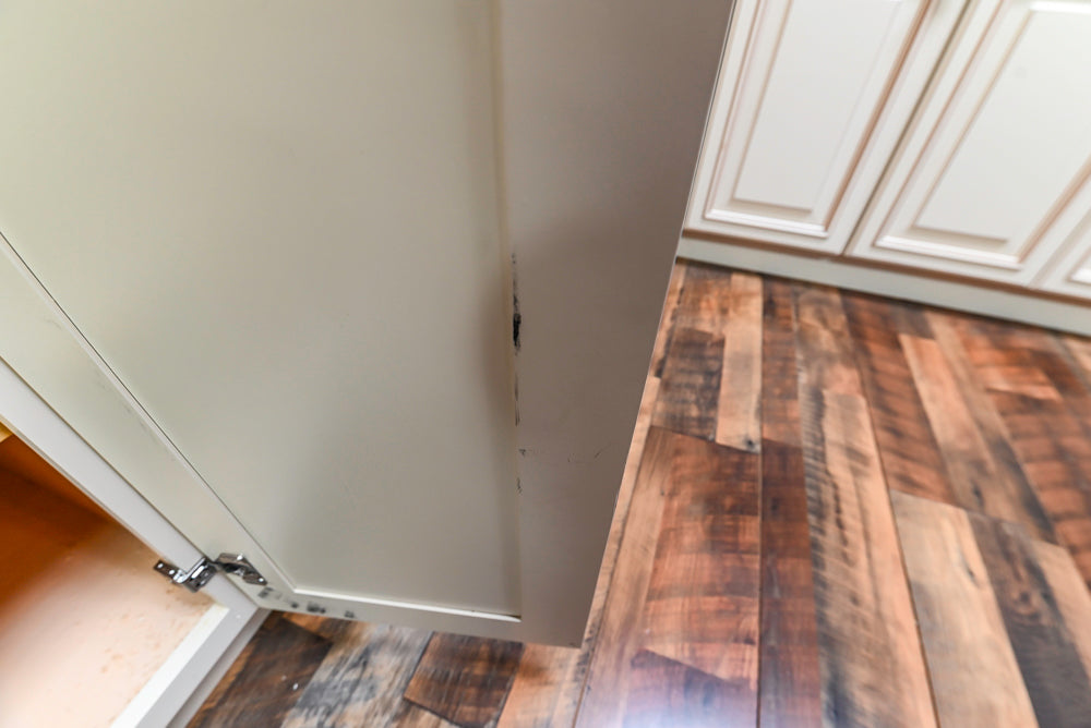 Light Cream Kitchen Corner with Quartz Countertops and Marble Top Island