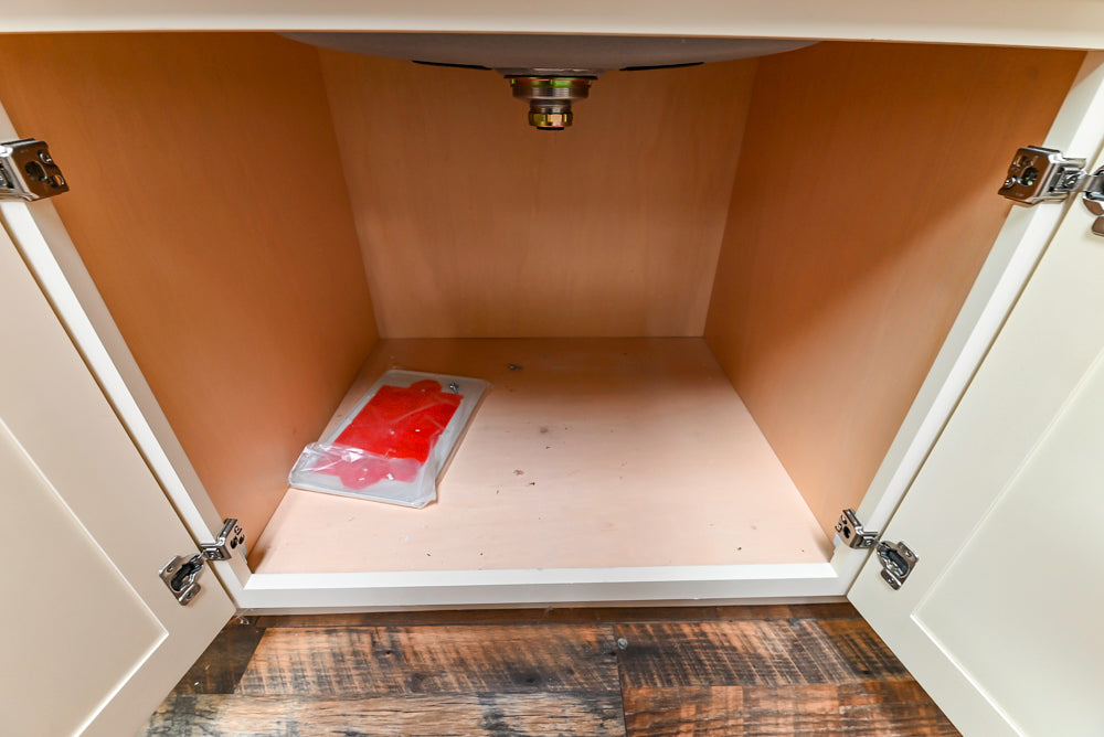 Light Cream Kitchen Corner with Quartz Countertops and Marble Top Island