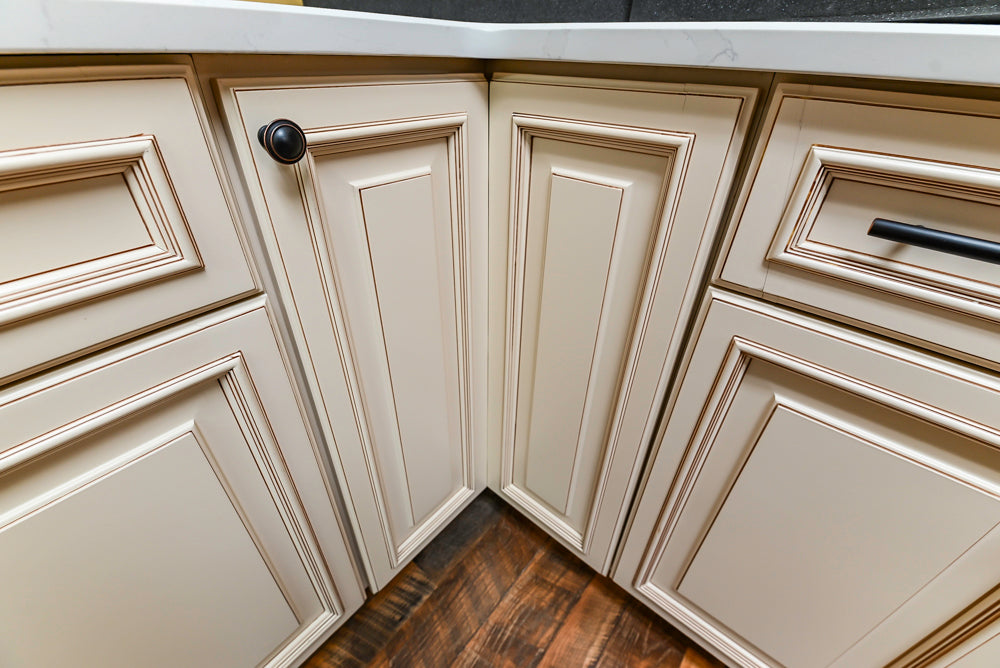 Light Cream Kitchen Corner with Quartz Countertops and Marble Top Island