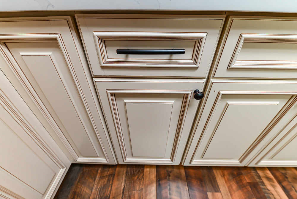 Light Cream Kitchen Corner with Quartz Countertops and Marble Top Island