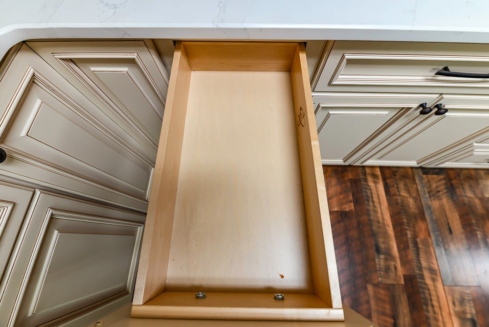 Light Cream Kitchen Corner with Quartz Countertops and Marble Top Island