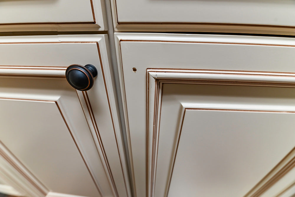 Light Cream Kitchen Corner with Quartz Countertops and Marble Top Island