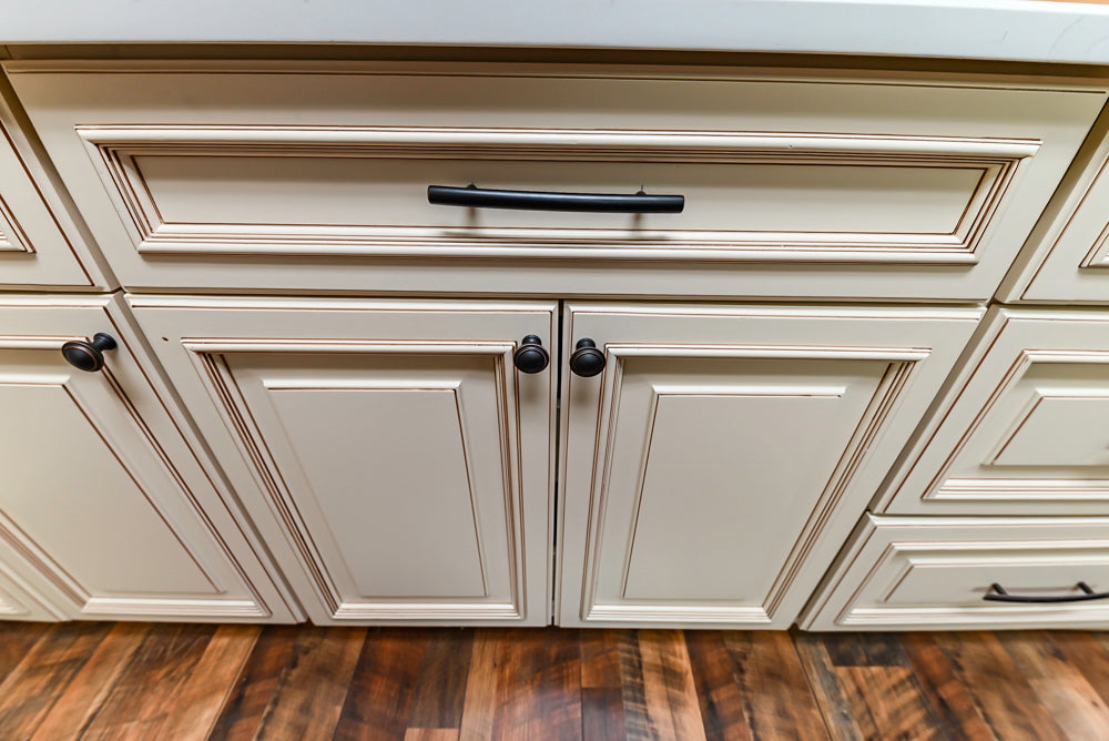 Light Cream Kitchen Corner with Quartz Countertops and Marble Top Island