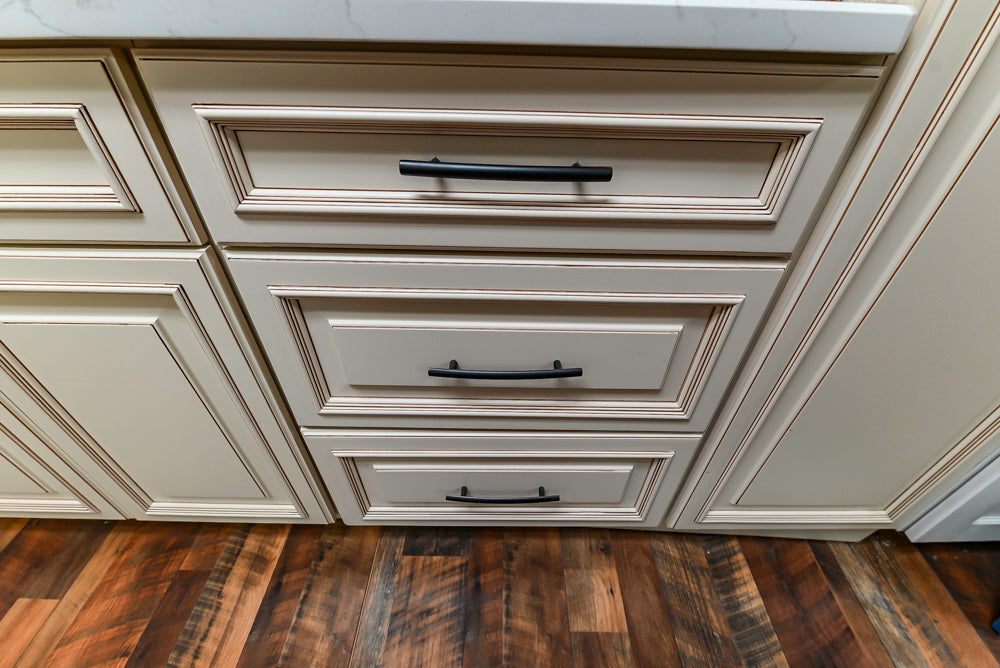 Light Cream Kitchen Corner with Quartz Countertops and Marble Top Island