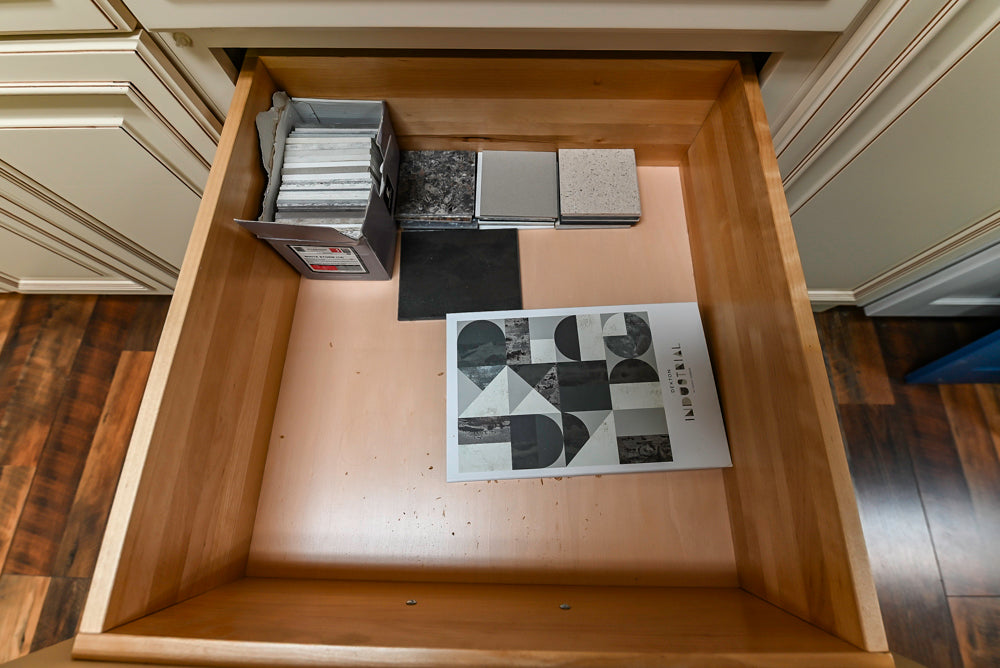 Light Cream Kitchen Corner with Quartz Countertops and Marble Top Island