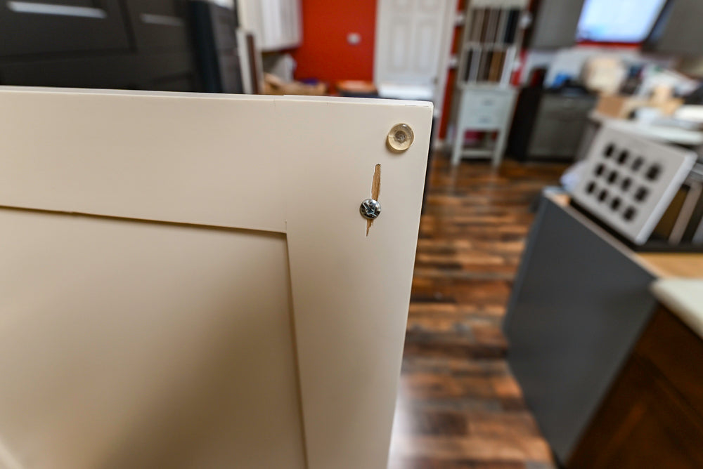 Light Cream Kitchen Corner with Quartz Countertops and Marble Top Island