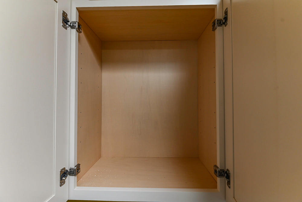 Light Cream Kitchen Corner with Quartz Countertops and Marble Top Island