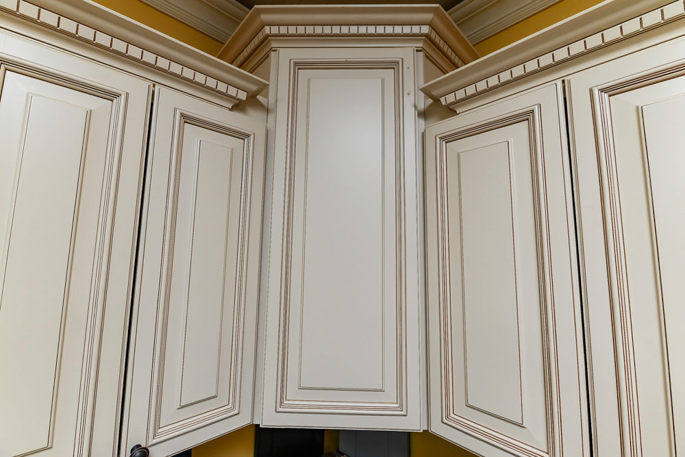 Light Cream Kitchen Corner with Quartz Countertops and Marble Top Island