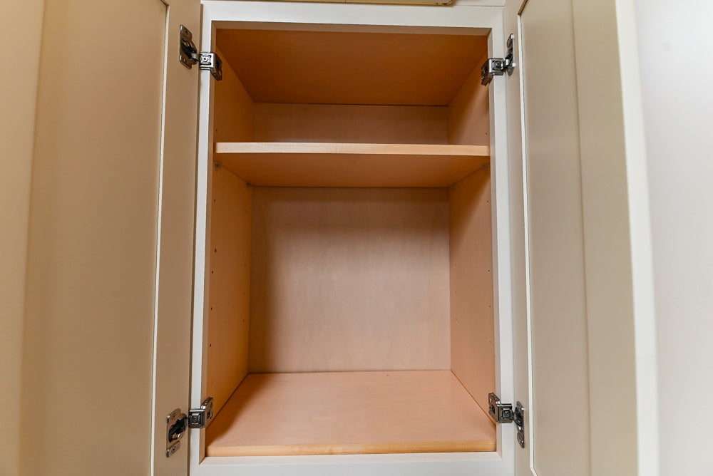 Light Cream Kitchen Corner with Quartz Countertops and Marble Top Island