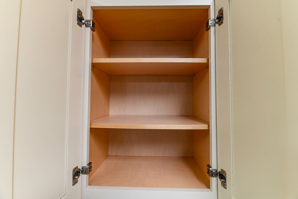 Light Cream Kitchen Corner with Quartz Countertops and Marble Top Island