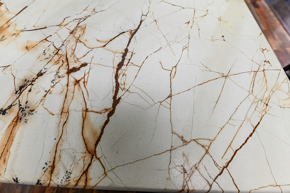 Light Cream Kitchen Corner with Quartz Countertops and Marble Top Island