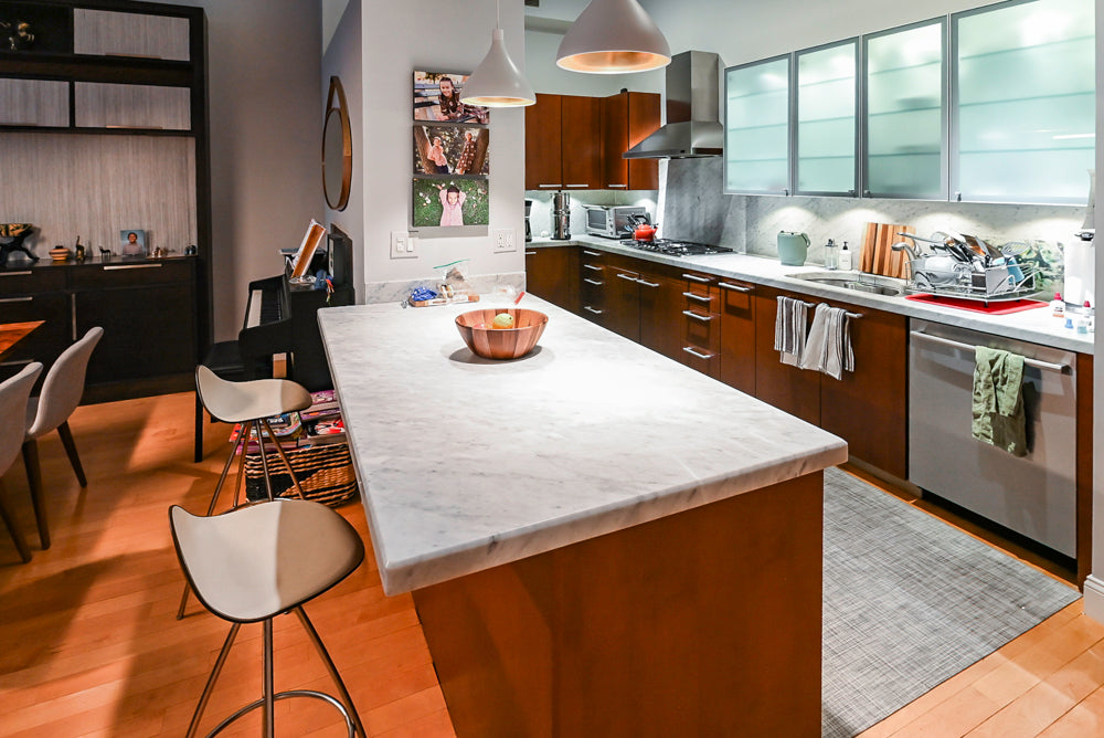 Poggenpohl Brown Toned Transitional Kitchen with Marble Countertops and Appliances