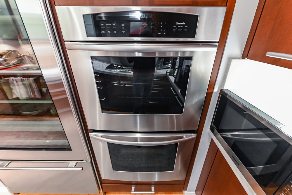 Poggenpohl Brown Toned Transitional Kitchen with Marble Countertops and Appliances
