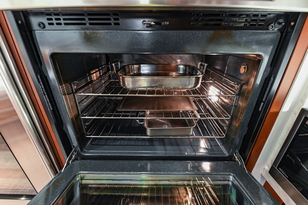 Poggenpohl Brown Toned Transitional Kitchen with Marble Countertops and Appliances
