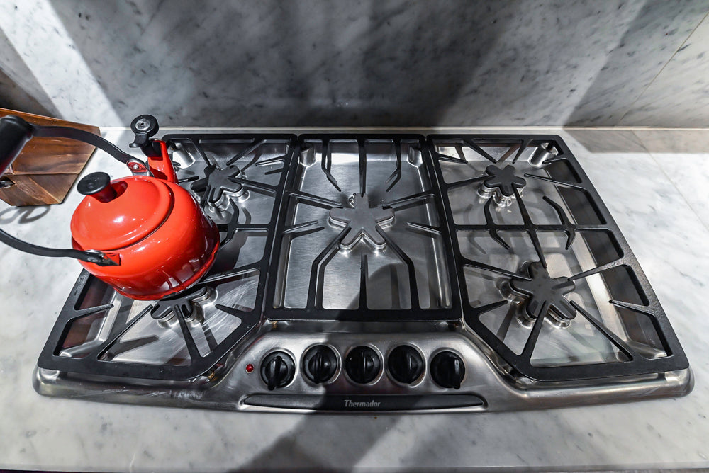 Poggenpohl Brown Toned Transitional Kitchen with Marble Countertops and Appliances