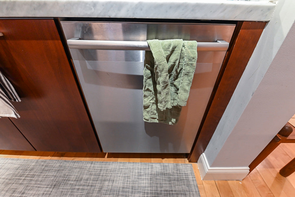 Poggenpohl Brown Toned Transitional Kitchen with Marble Countertops and Appliances