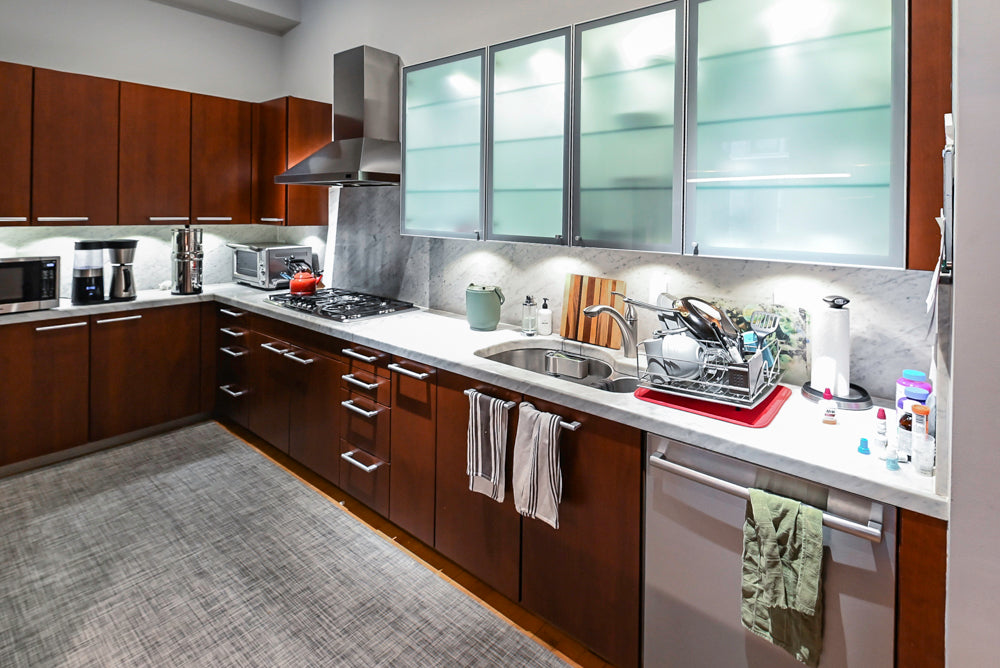Poggenpohl Brown Toned Transitional Kitchen with Marble Countertops and Appliances