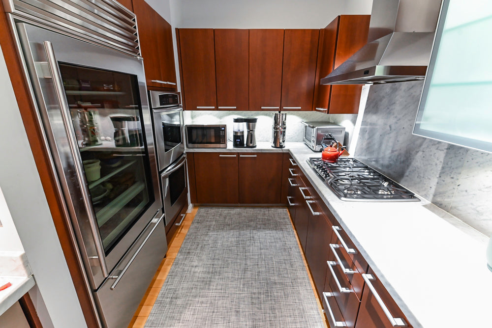 Poggenpohl Brown Toned Transitional Kitchen with Marble Countertops and Appliances