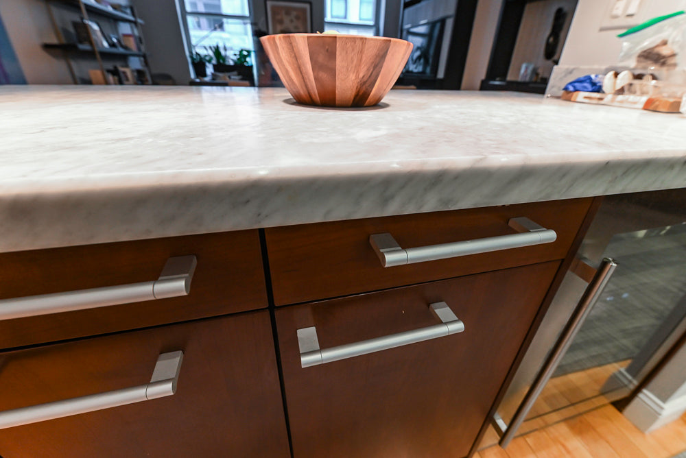 Poggenpohl Brown Toned Transitional Kitchen with Marble Countertops and Appliances