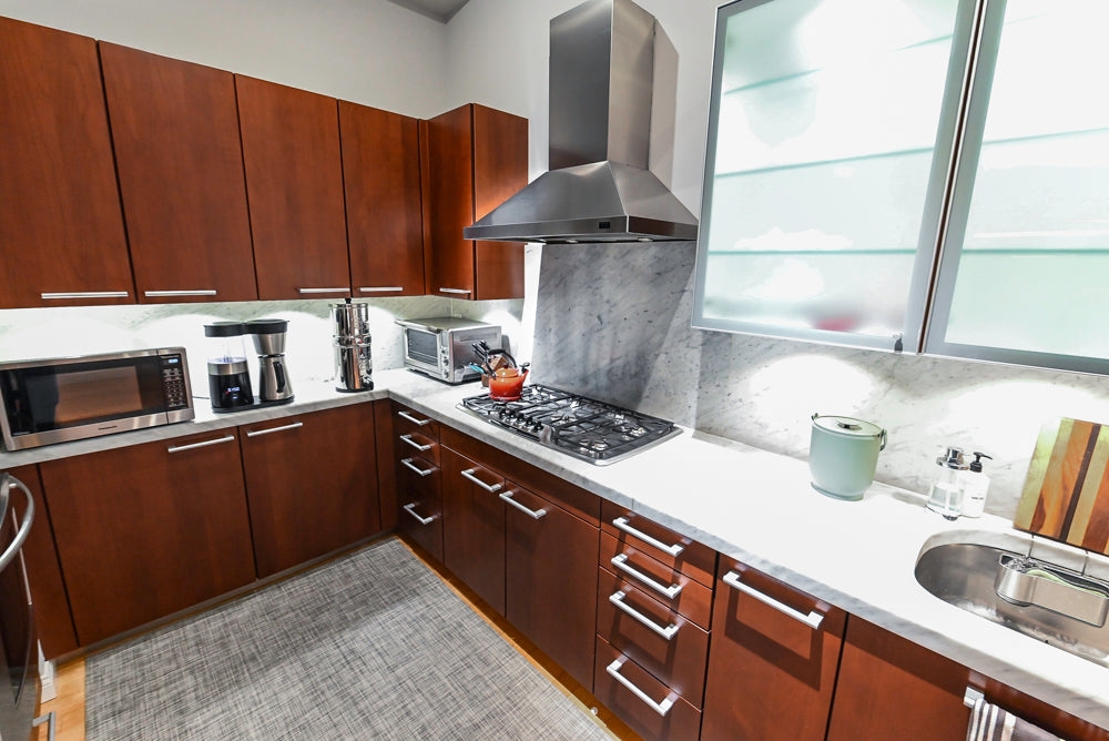 Poggenpohl Brown Toned Transitional Kitchen with Marble Countertops and Appliances