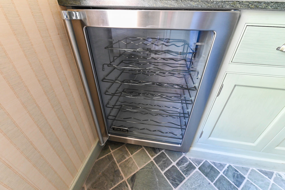 Traditional Washed Out Light Green Butler's Pantry with Granite Countertops and Viking Appliances
