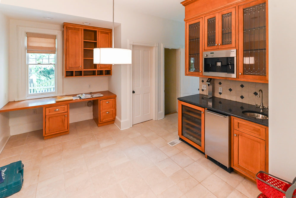 Traditional Wooden Butler's Pantry with Sub-Zero Wine Cooler & Desk Area