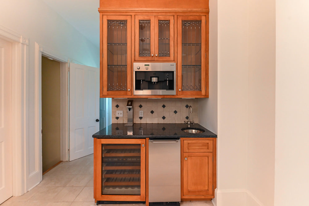 Traditional Wooden Butler's Pantry with Sub-Zero Wine Cooler & Desk Area