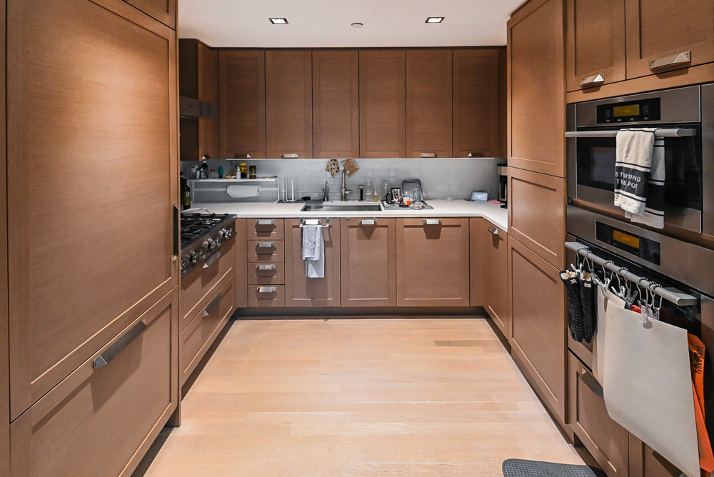 Stevali Brown Oak Transitional Kitchen with Stone Countertops and Luxe Appliances