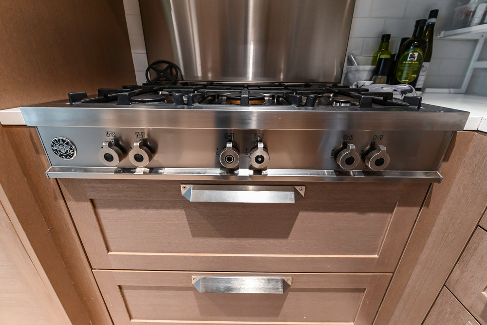 Stevali Brown Oak Transitional Kitchen with Stone Countertops and Luxe Appliances