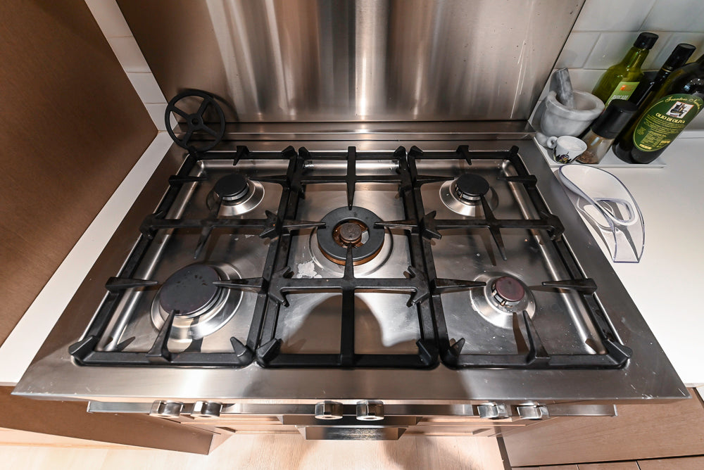 Stevali Brown Oak Transitional Kitchen with Stone Countertops and Luxe Appliances