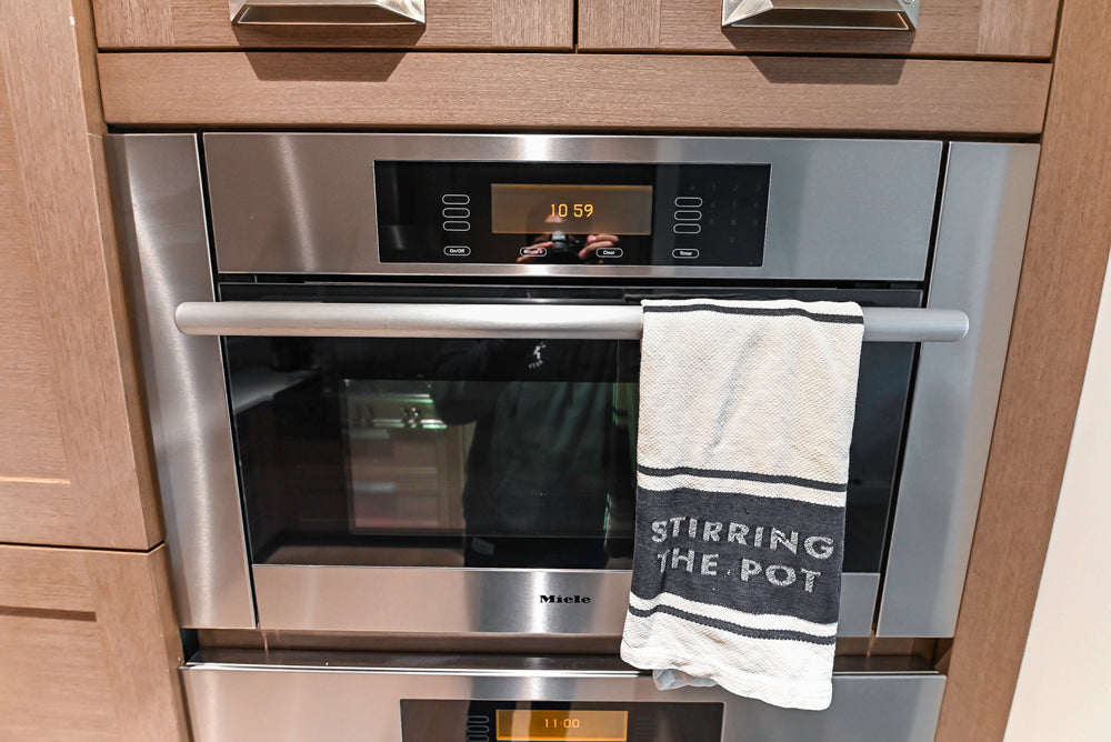 Stevali Brown Oak Transitional Kitchen with Stone Countertops and Luxe Appliances