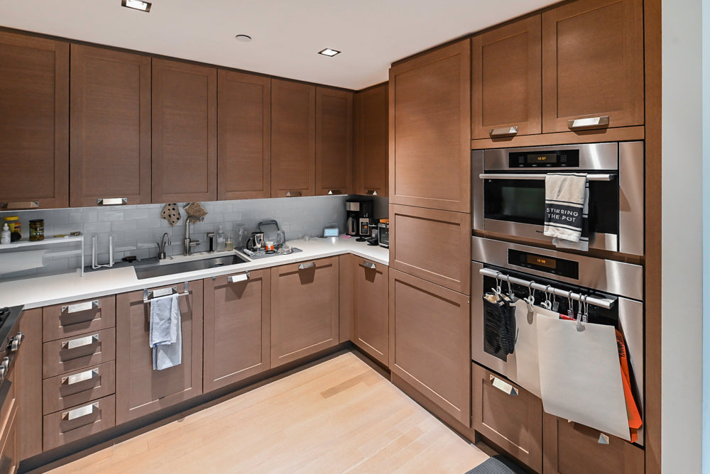 Stevali Brown Oak Transitional Kitchen with Stone Countertops and Luxe Appliances