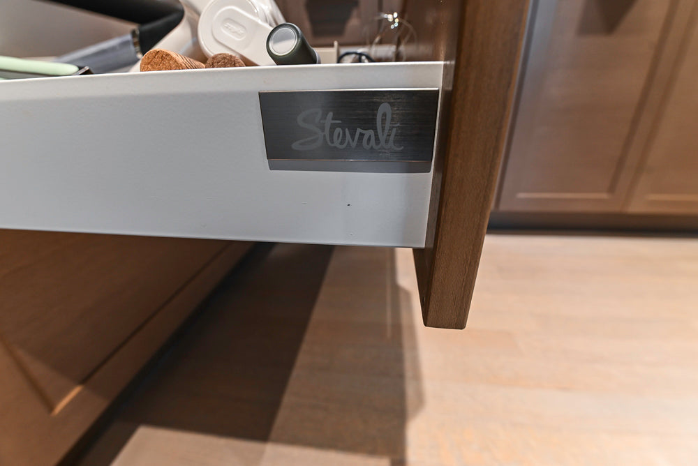 Stevali Brown Oak Transitional Kitchen with Stone Countertops and Luxe Appliances