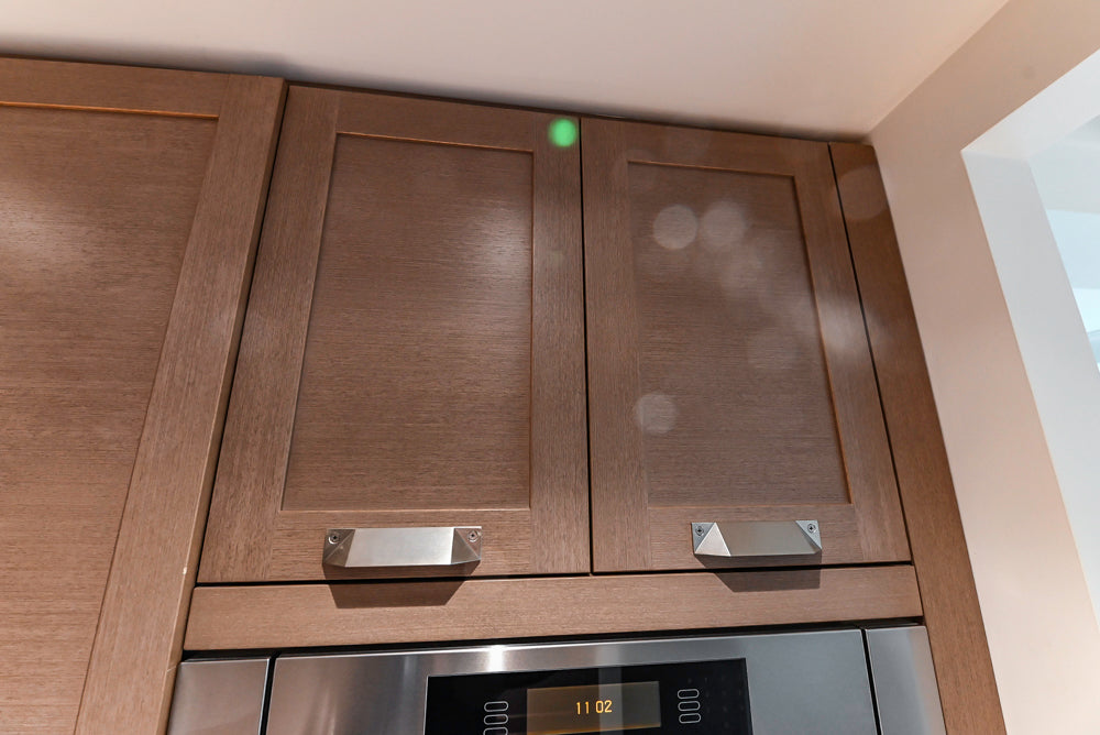 Stevali Brown Oak Transitional Kitchen with Stone Countertops and Luxe Appliances