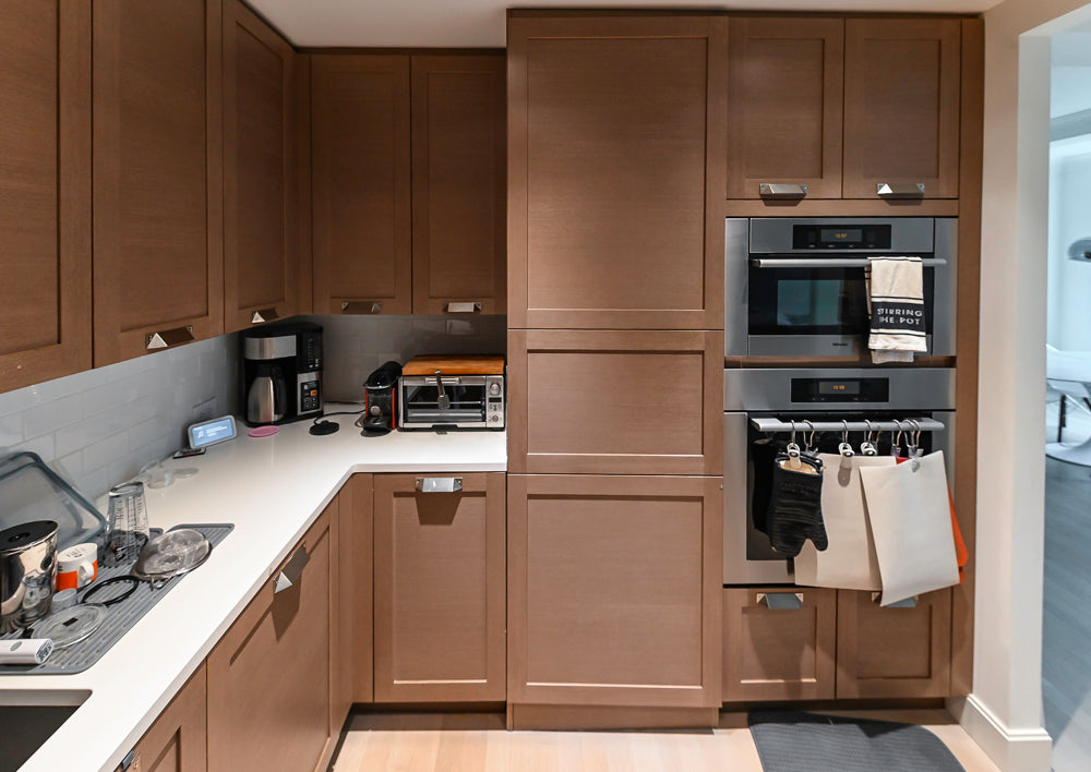 Stevali Brown Oak Transitional Kitchen with Stone Countertops and Luxe Appliances