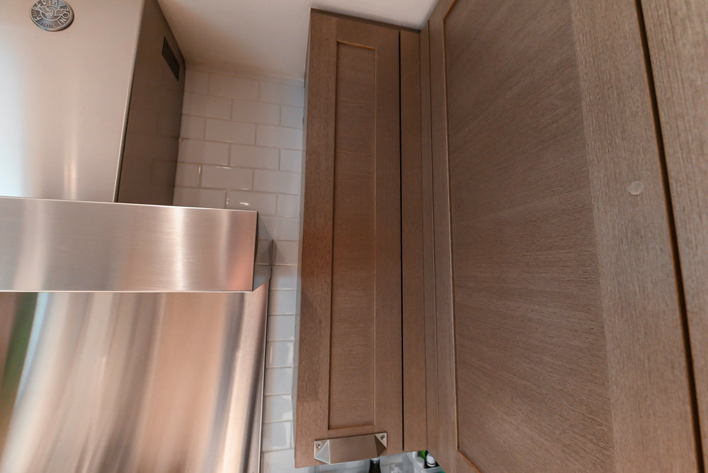 Stevali Brown Oak Transitional Kitchen with Stone Countertops and Luxe Appliances