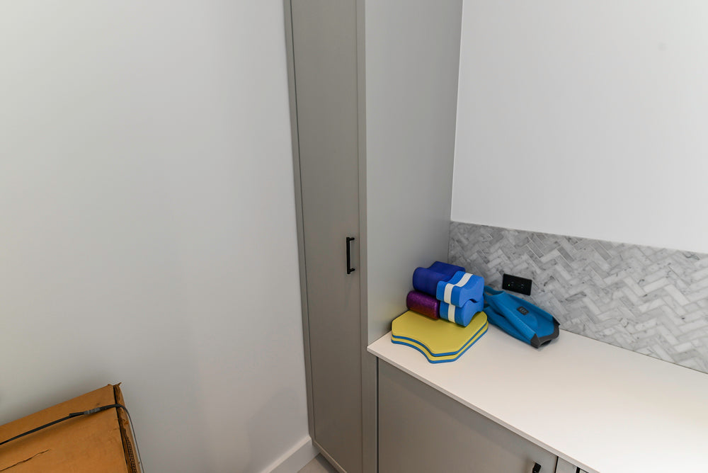 Custom Modern Light Grey Pantry with White Stone Countertops and Stainless Steel Sink