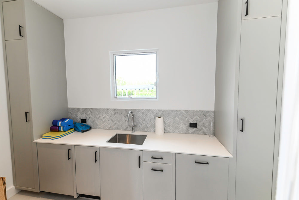 Custom Modern Light Grey Pantry with White Stone Countertops and Stainless Steel Sink